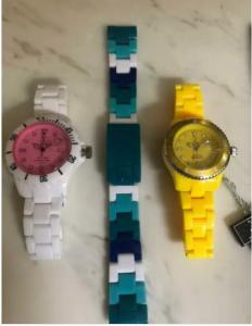 2 watches and an extra strap